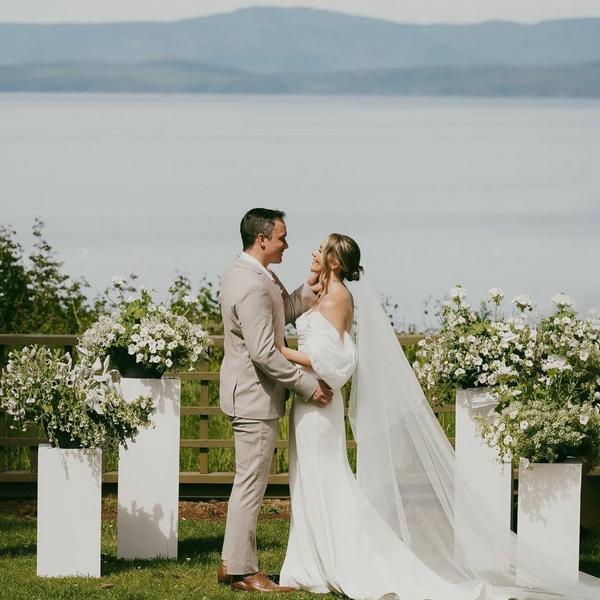 Couple getting married near the ocean.